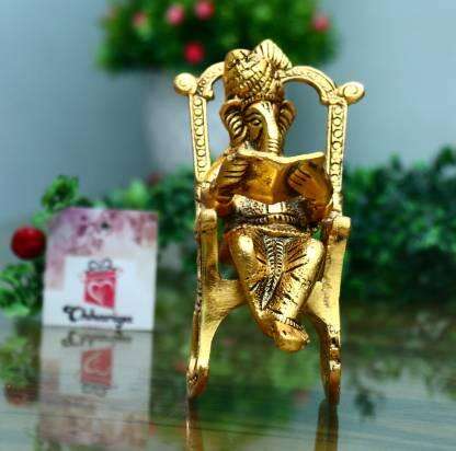 Golden Lord Ganesha Statue Sitting On A Rocking Chair And Reading Ramayan Showpiece Mystical9